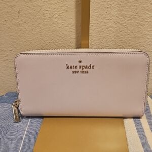 kate spade light purple/pink zip-around saffiano wallet with gold logo